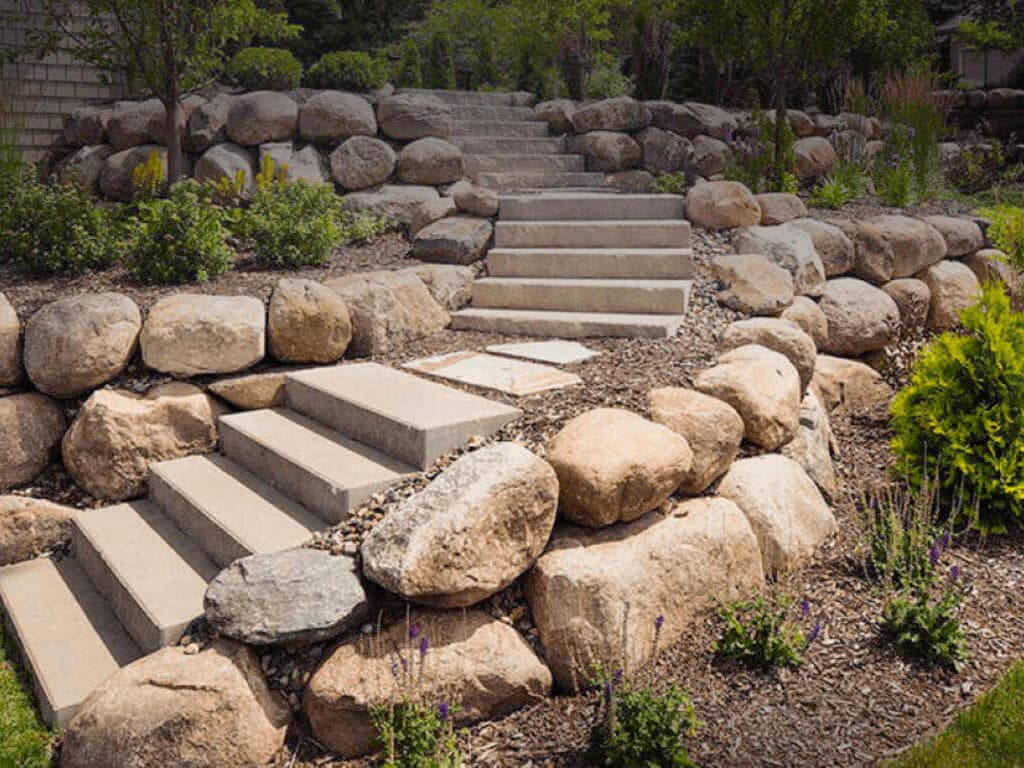 Stone retaining wall with steps